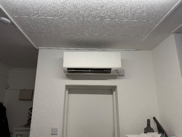 The indoor unit placed above a doorway